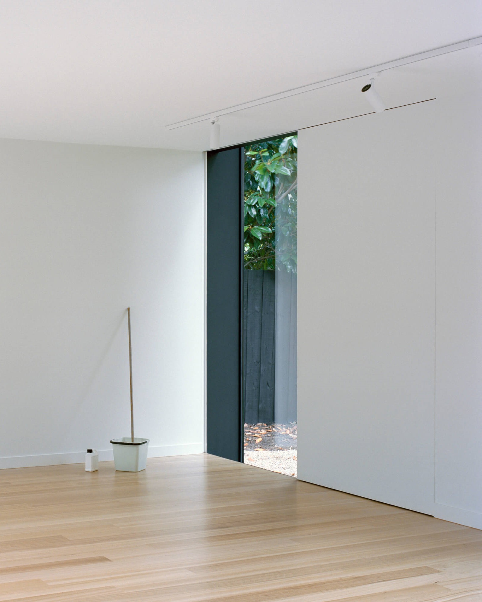 Concealed sliding panel in front of glazing. Ellul Architecture. Sandringham House