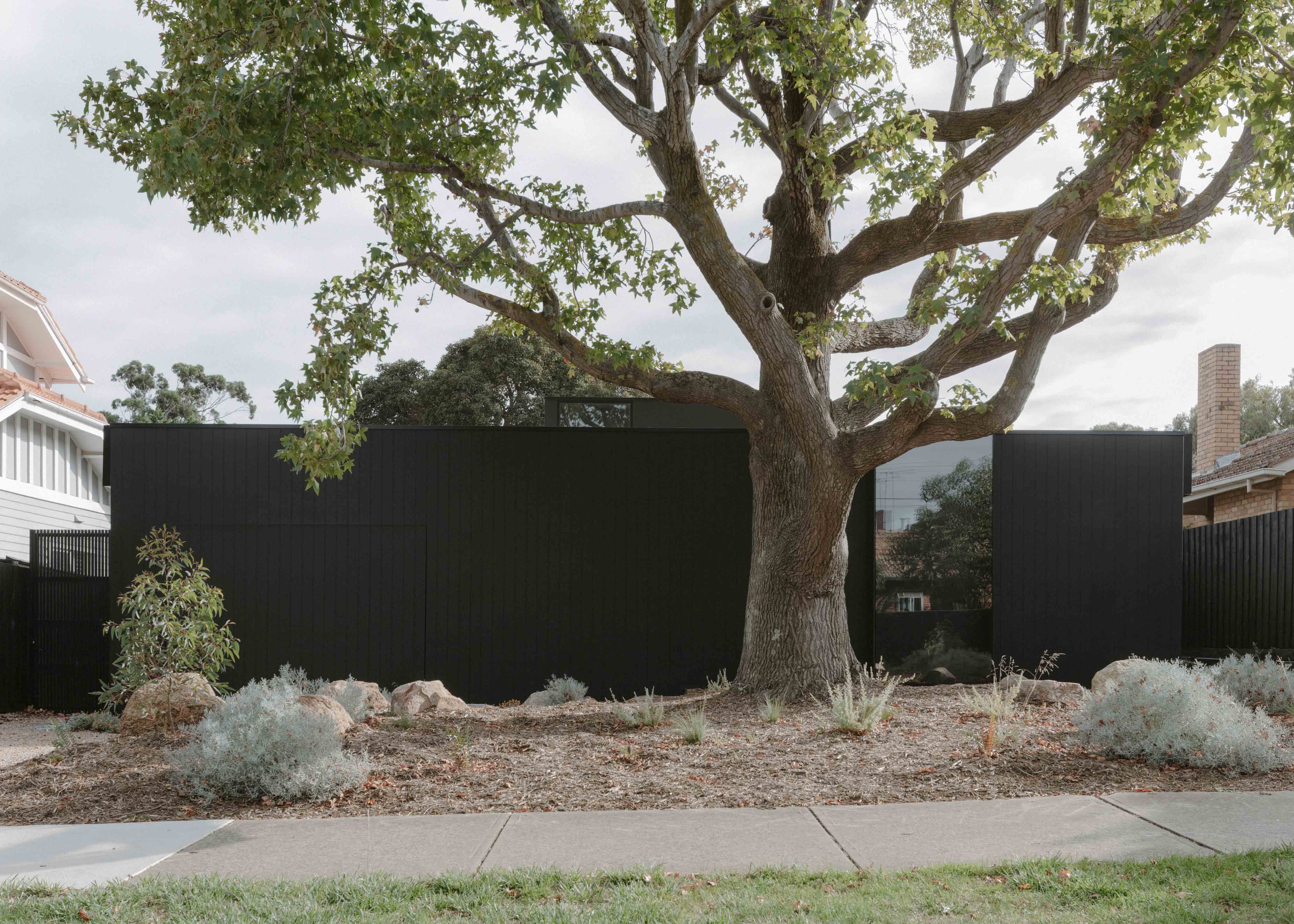 Recessive Facade with Vertical Black Cladding. Ellul Architecture. Sandringham House