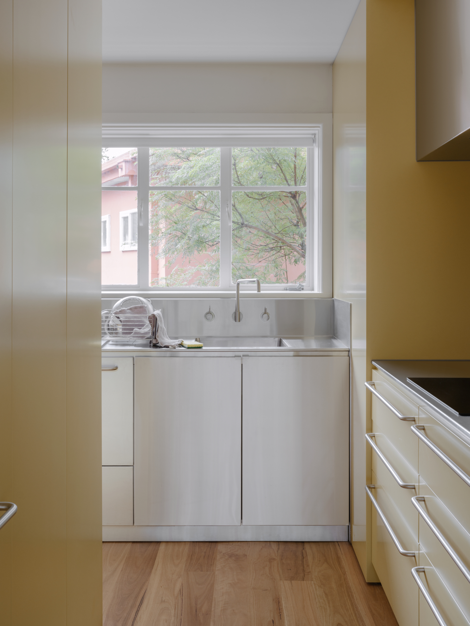Stainless Steel. Wash Up Station. Kitchen. Butter Yellow. Caringal Flats. Ellul Architecture