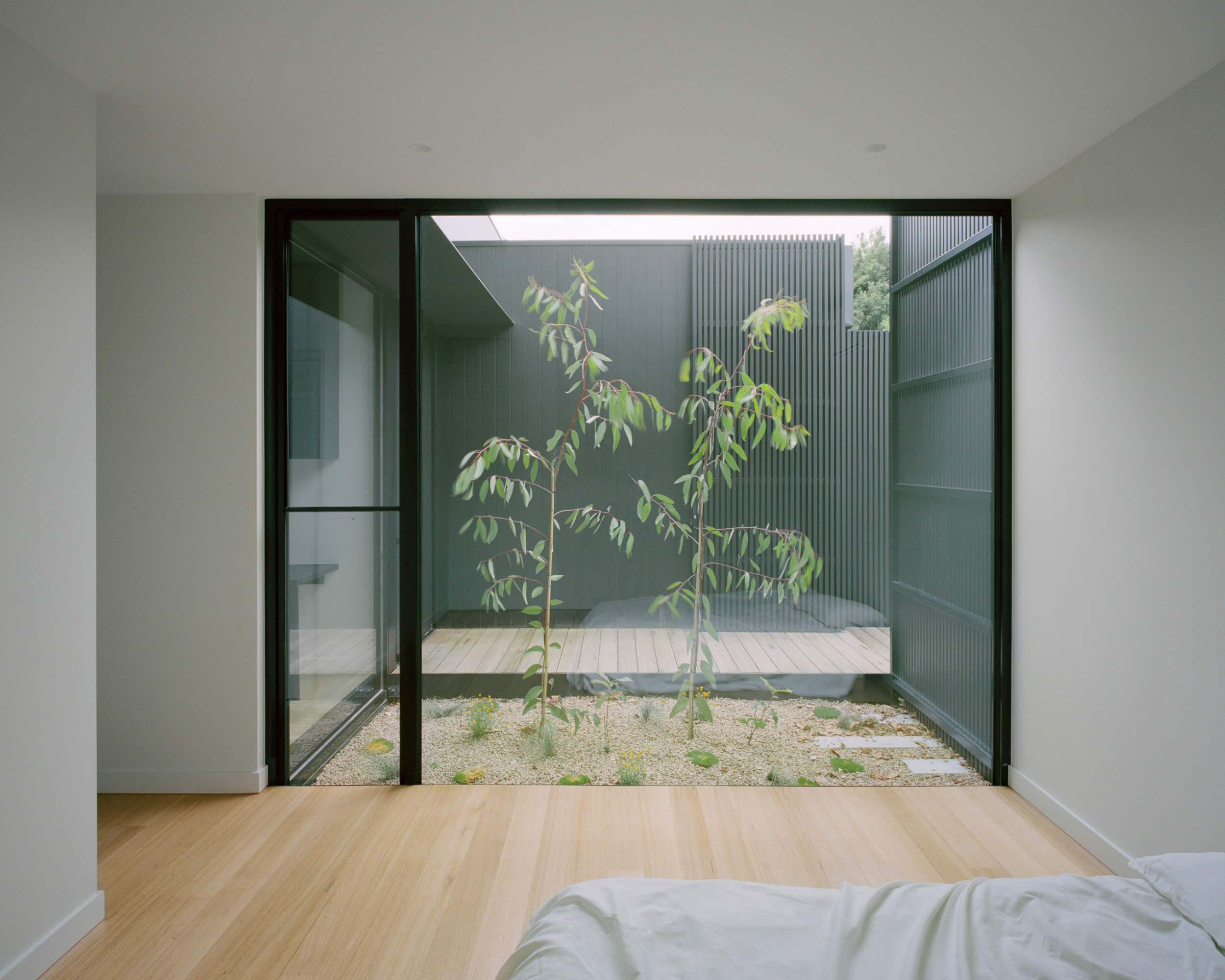 Bedroom with Native Coastal Courtyard. Ellul Architecture. Sandringham House